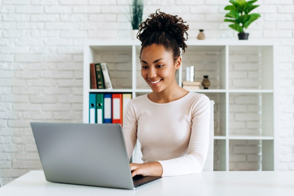 Beautiful girl working on a computer at home