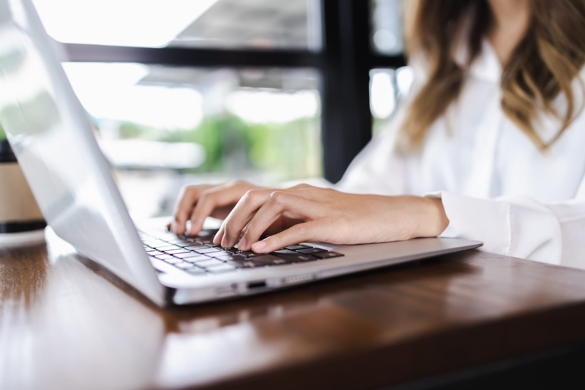 Business Woman hands typing on computer keyboard. Business Woman working on laptop.