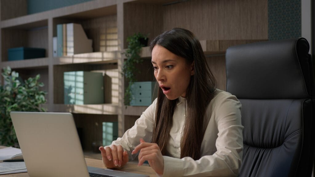 Caucasian business woman working on laptop feel stressed about system virus shocked girl