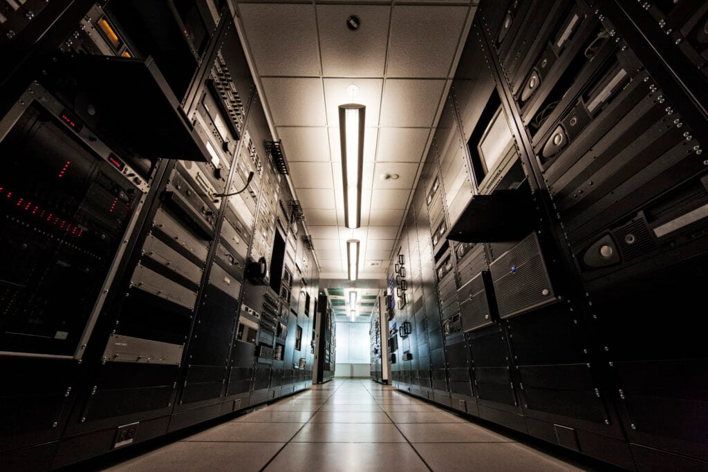 Storage racks aligned in a computer server room.